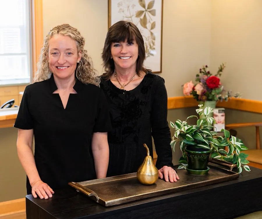 Dr. Lois Townshend and Dr. Kristin Kenney in the reception area of The Eye Center