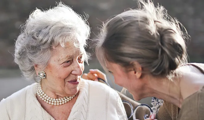 A grandmother and her daughter sharing a moment